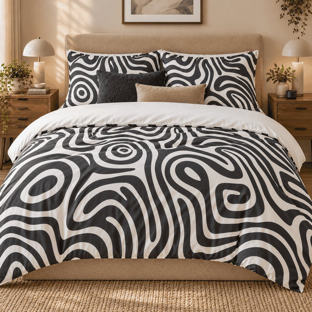 Monochrome Swirl Abstract duvet cover set, front view showing charcoal and ivory swirls on a boucle bed with dome lamps