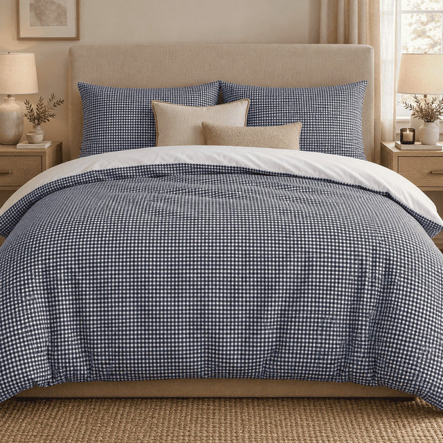 Navy Gingham duvet cover set, front view showing the navy check with two pillowcases and cream and sand cushions