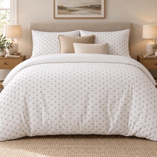 White Taupe Pebble Stack duvet cover set, front view showing small sand and taupe marks on white with camel and cream cushions