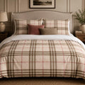 Beige Plaid duvet cover set, front view showing cream check with taupe stripes and rose lines on a studded headboard bed