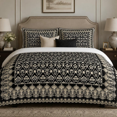 Black Ivory Framed Heritage duvet cover set, front view showing an ivory damask lattice on black with a lotus border