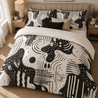 Black Ivory Retro Abstract duvet cover set, overhead view showing the full retro print with black and oatmeal cushions