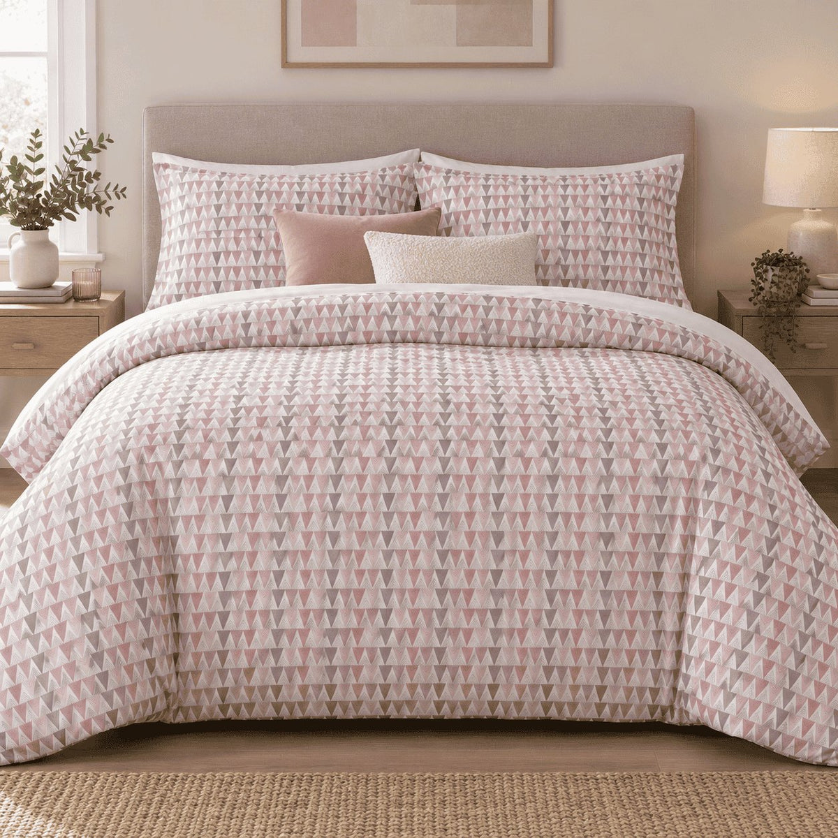Blush Grey Triangle duvet cover set, front view showing blush, rose and grey triangle rows with pink and cream cushions