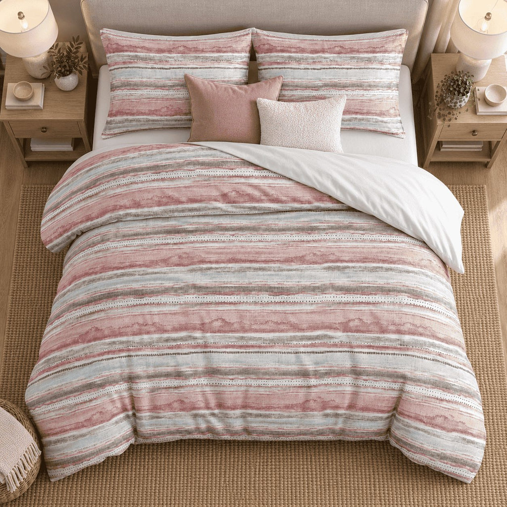 Blush Duck Egg Washed Stripe duvet cover set, overhead view showing blush and duck egg bands, basket and throw