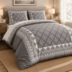 Charcoal Dove Framed Heritage duvet cover set, angled view showing the lotus border, roundel chain and charcoal edge