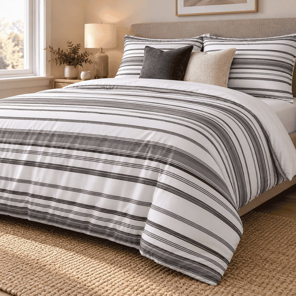Charcoal Grey Stripe duvet cover set, angled view showing charcoal pinstripe bands and a white turndown