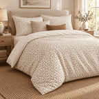 Cream Brown Triangle Lattice duvet cover set, angled view showing the speckle print draped beside an oak bedside table