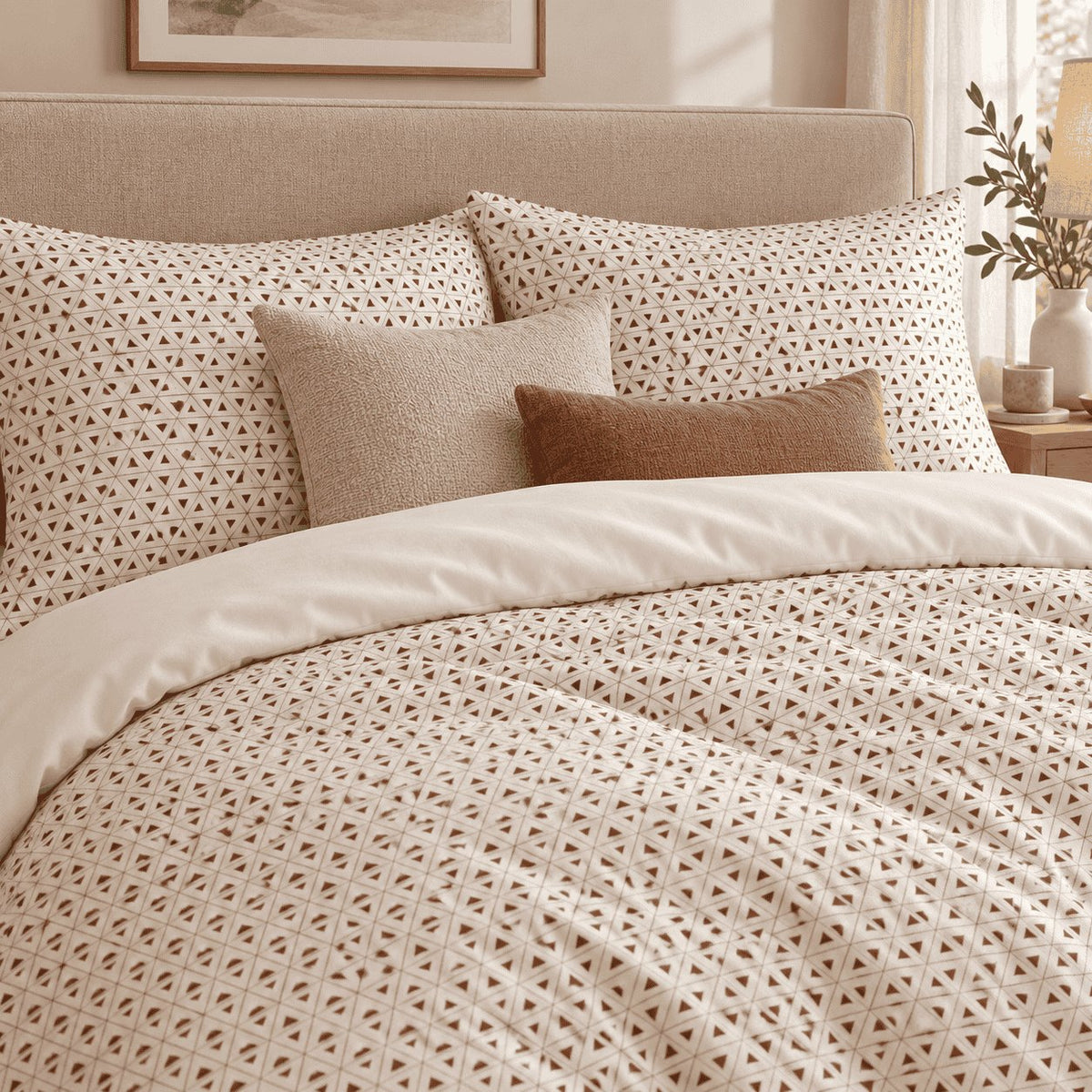 Cream Brown Triangle Lattice duvet cover set, close-up of pillowcases showing two pillowcases behind oatmeal and tan cushions