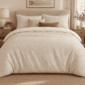 Cream Brown Triangle Lattice duvet cover set, front view showing brown triangle speckle on cream with tan cushions