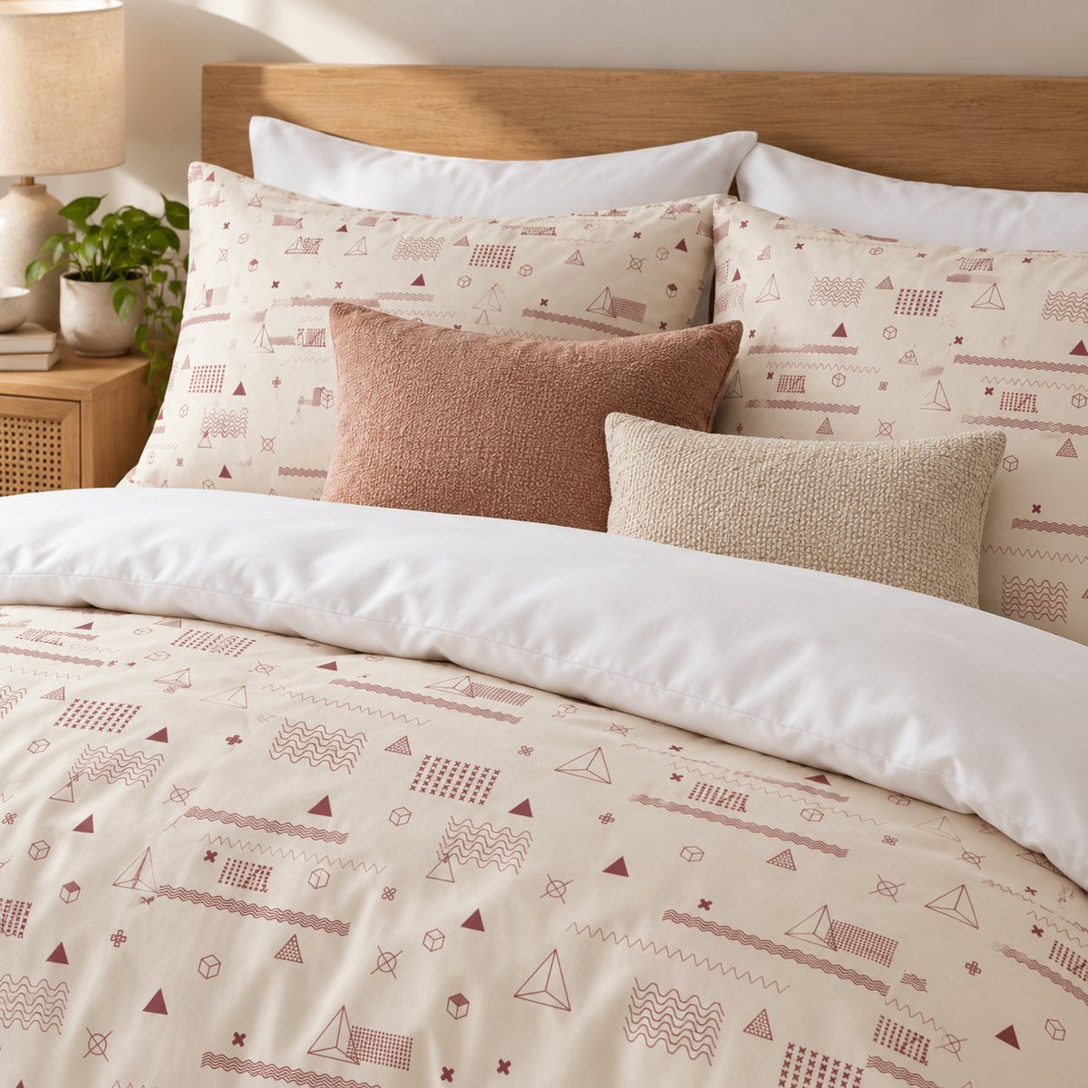 Cream Rose Retro Geometric duvet cover set, close-up of print showing rose-red waves, cubes and pyramids on cream