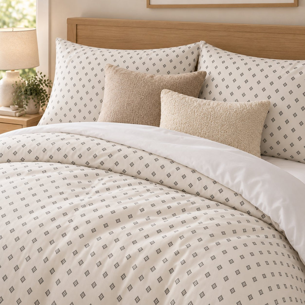 Grey Cross Stitch Geometric duvet cover set, close-up of print showing grey diamonds with ivory centre crosses
