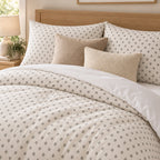 Grey Cross Stitch Geometric duvet cover set, close-up of print showing grey diamonds with ivory centre crosses