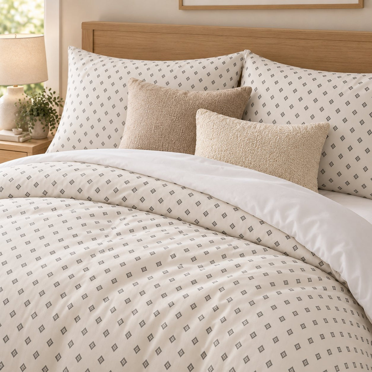 Grey Cross Stitch Geometric duvet cover set, close-up of print showing grey diamonds with ivory centre crosses