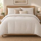 Grey Cross Stitch Geometric duvet cover set, front view showing grey diamonds on ivory with oatmeal and cream cushions