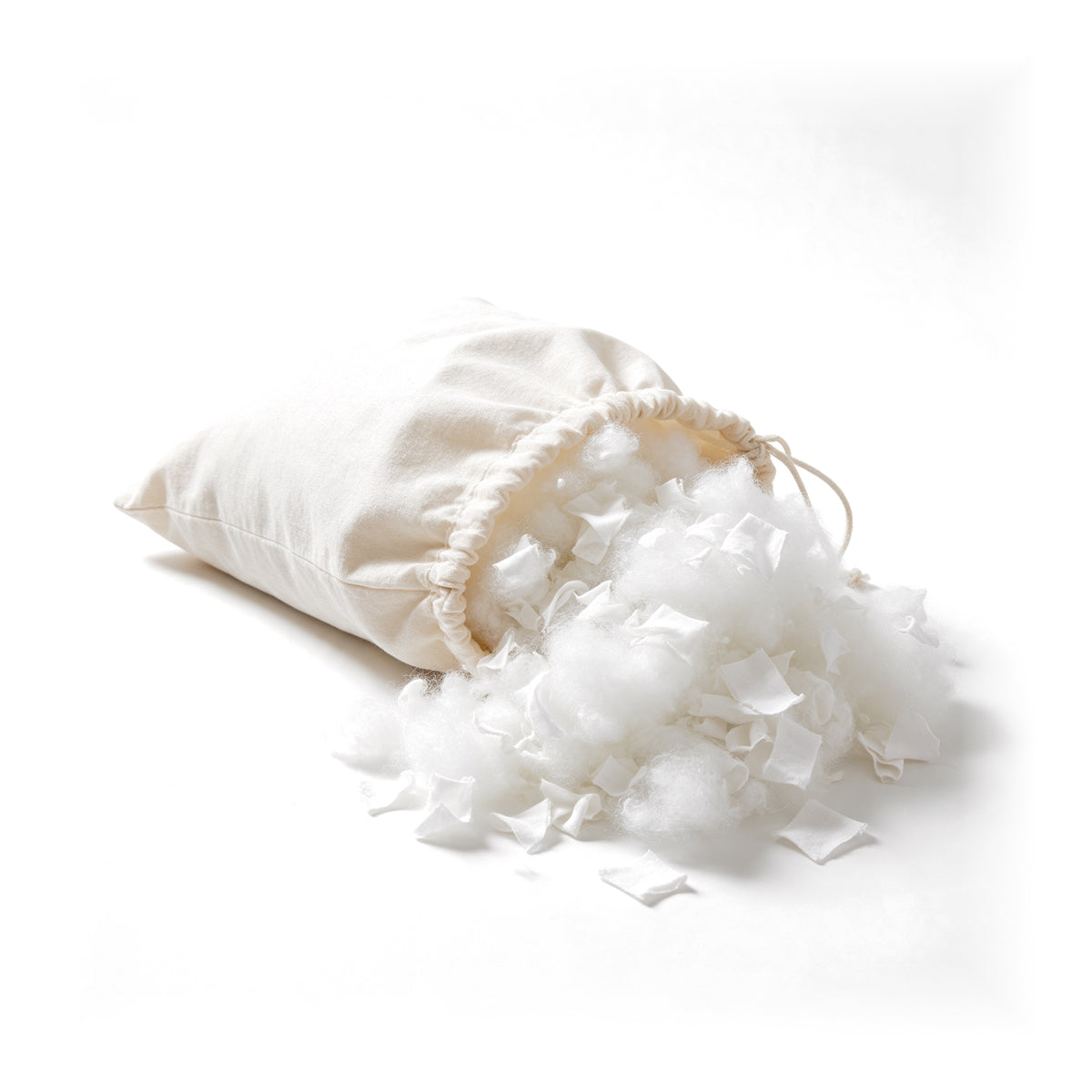 Hollowfibre Off-Cuts Filling, carded fibre and fabric off-cuts spilling from a cotton sack on white