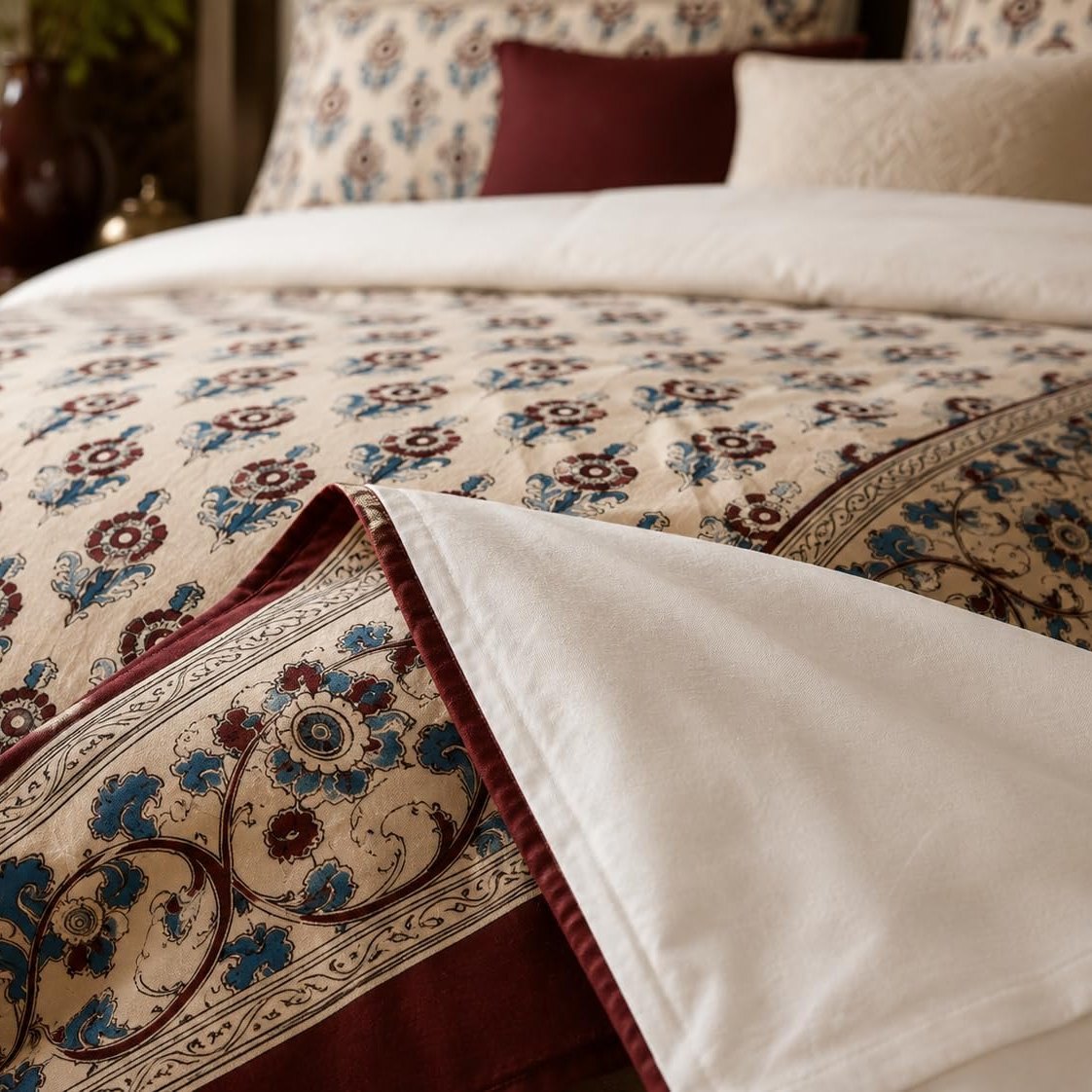 Ivory Burgundy Framed Heritage duvet cover set, corner detail showing the rosette print folded back to the plain reverse