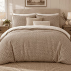 Mocha Gingham duvet cover set, front view showing the mocha check with taupe and cream cushions on white pillows