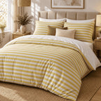 Mustard Yellow Stripe duvet cover set, angled view showing mustard yellow deckchair stripes and a white turndown