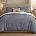 Navy Gingham duvet cover set, front view showing the navy check with two pillowcases and cream and sand cushions
