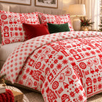 Nordic Christmas Reversible duvet cover set, angled view showing folk-art side with snowflake reverse folded back