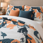 Orange Navy Splash Abstract duvet cover set, close-up of splash pillowcases with orange and navy cushions