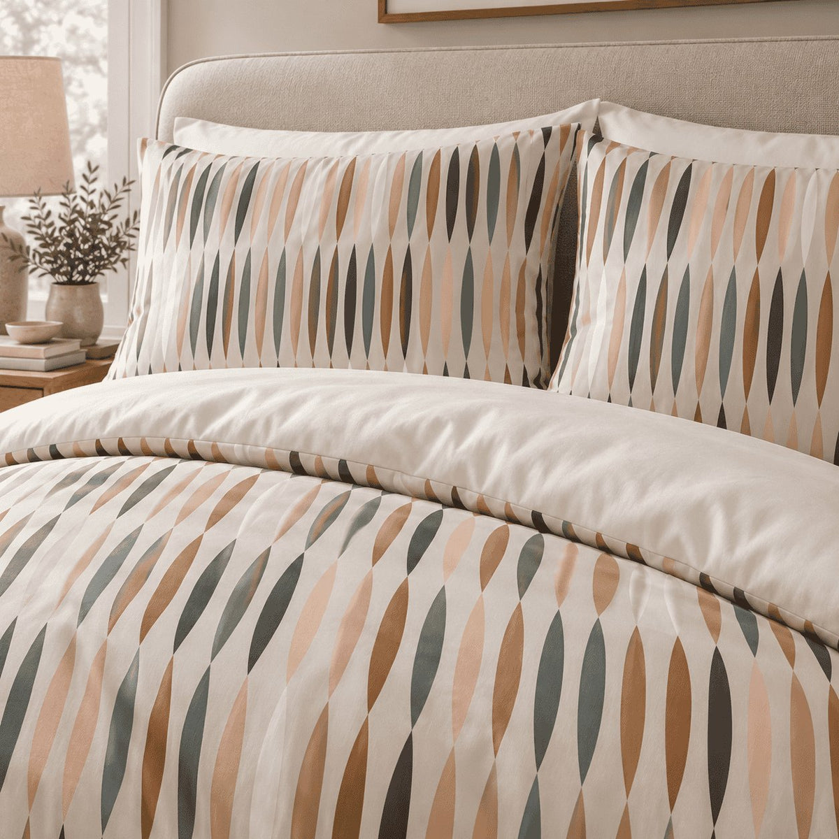 Peach Sage Leaf Stripe duvet cover set, pillowcase detail showing peach and sage almond print pillowcases over white pillows