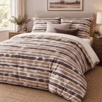 Plum Caramel Washed Stripe duvet cover set, angled view showing distressed aubergine and caramel stripe bands