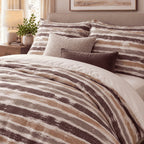 Plum Caramel Washed Stripe duvet cover set, turndown detail showing dry-brushed plum and caramel stripes with streaky edges