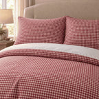 Raspberry Red Gingham duvet cover set, close-up of pillowcases showing red check pillowcases above the turned-down duvet
