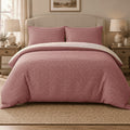 Raspberry Red Gingham duvet cover set, front view showing the red check with two pillowcases on a curved headboard bed