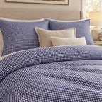 Royal Blue Gingham duvet cover set, close-up of pillowcases showing pillowcases behind fringed linen and knit cushions