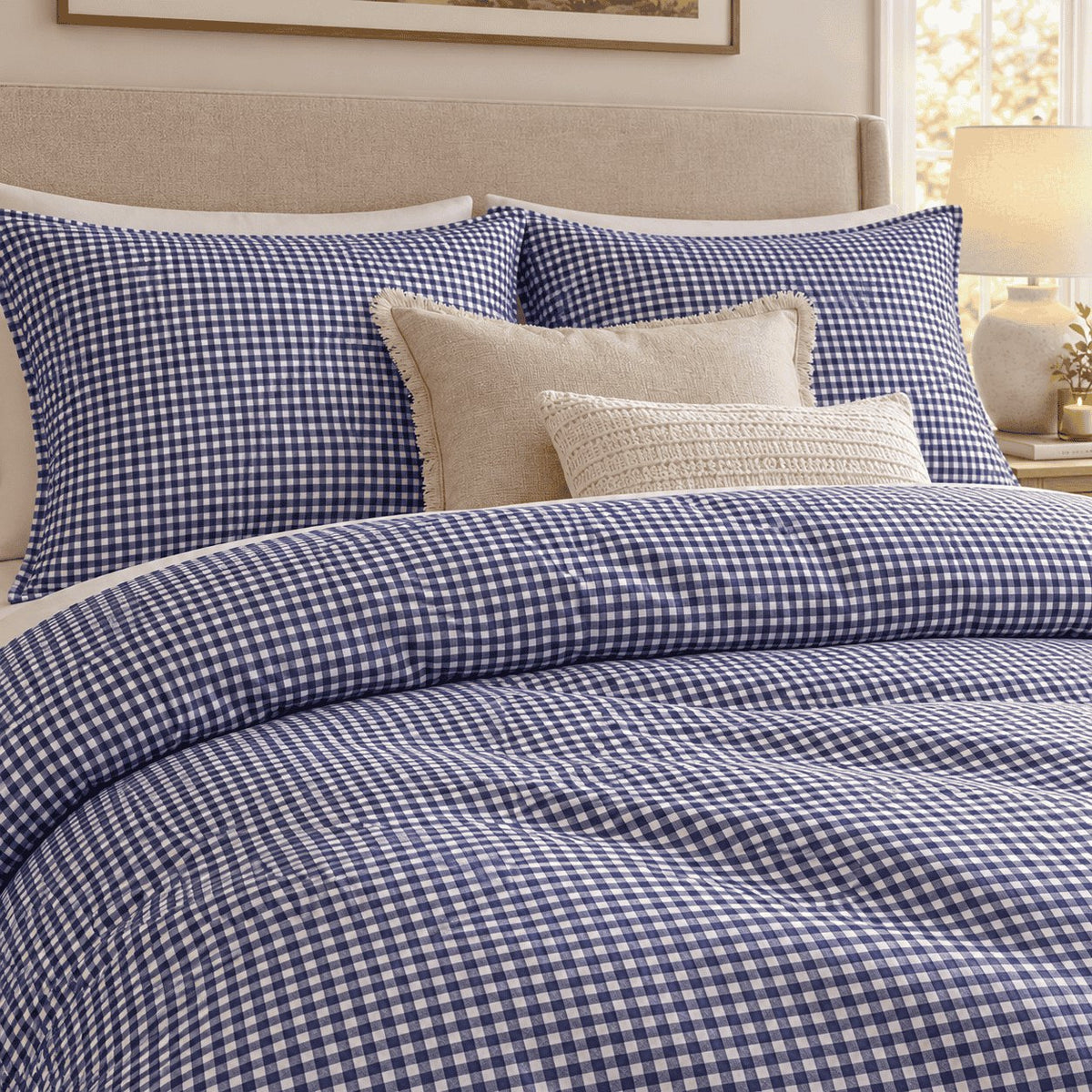 Royal Blue Gingham duvet cover set, close-up of pillowcases showing pillowcases behind fringed linen and knit cushions