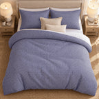 Royal Blue Gingham duvet cover set, overhead view showing the full bed on a jute rug between oak bedside tables
