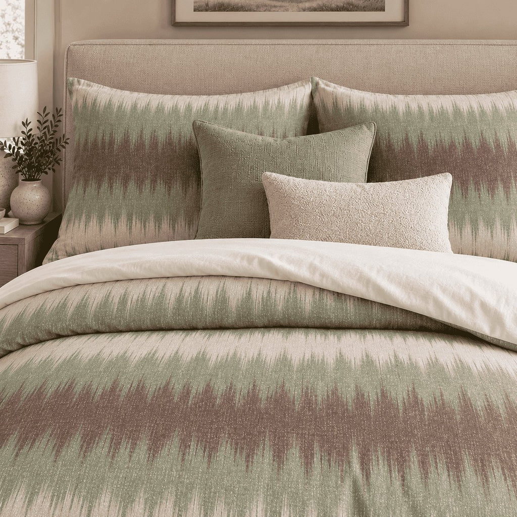 Sage Mocha Flame Stitch duvet cover set, close-up of flame-stitch pillowcases with sage and boucle cushions