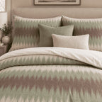 Sage Mocha Flame Stitch duvet cover set, close-up of flame-stitch pillowcases with sage and boucle cushions
