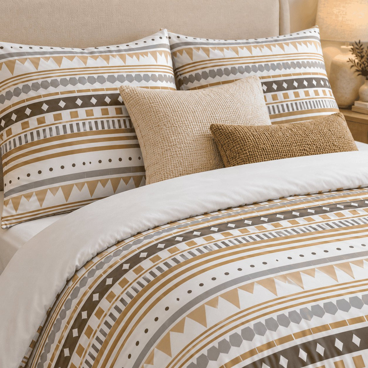 Sand Aztec Stripe duvet cover set, pillowcase detail showing Aztec pillowcases with cream waffle and caramel cushions