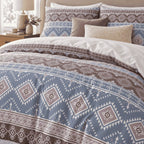 Slate Blue Aztec Stripe duvet cover set, print detail showing white stepped diamonds with mauve-taupe centres on slate blue