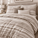 Stone Taupe Washed Stripe duvet cover set, turndown detail showing brushed taupe stripes with a speckled linen texture