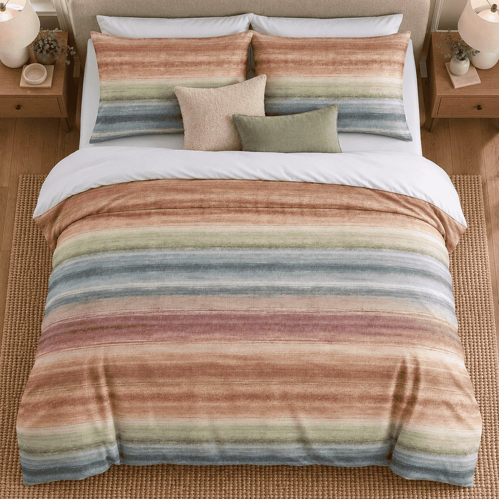 Sunset Watercolour Stripe duvet cover set, overhead view showing terracotta, sage, blue and berry stripes