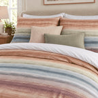 Sunset Watercolour Stripe duvet cover set, pillowcase detail showing pillowcases with blush bouclé and sage cushions