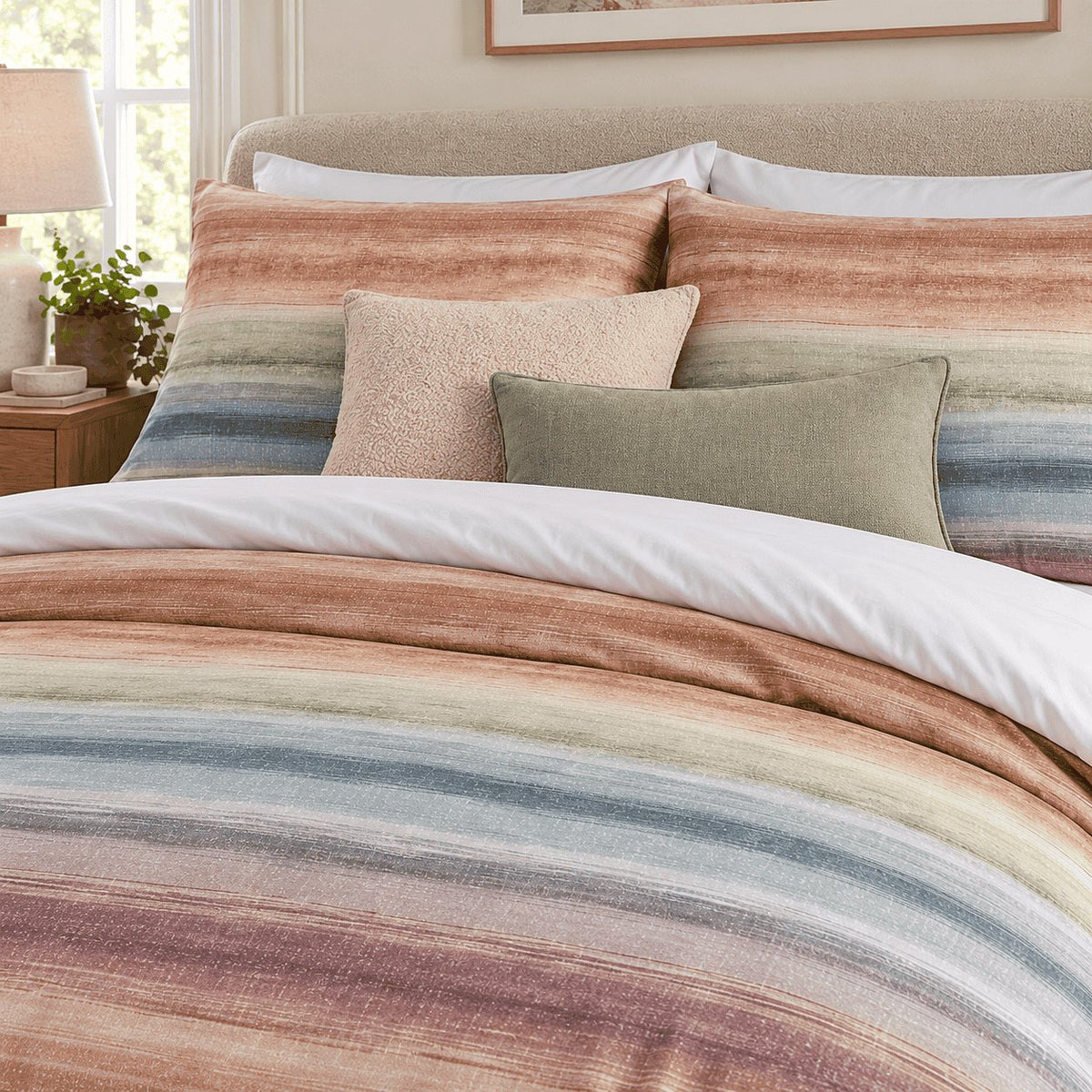 Sunset Watercolour Stripe duvet cover set, pillowcase detail showing pillowcases with blush bouclé and sage cushions