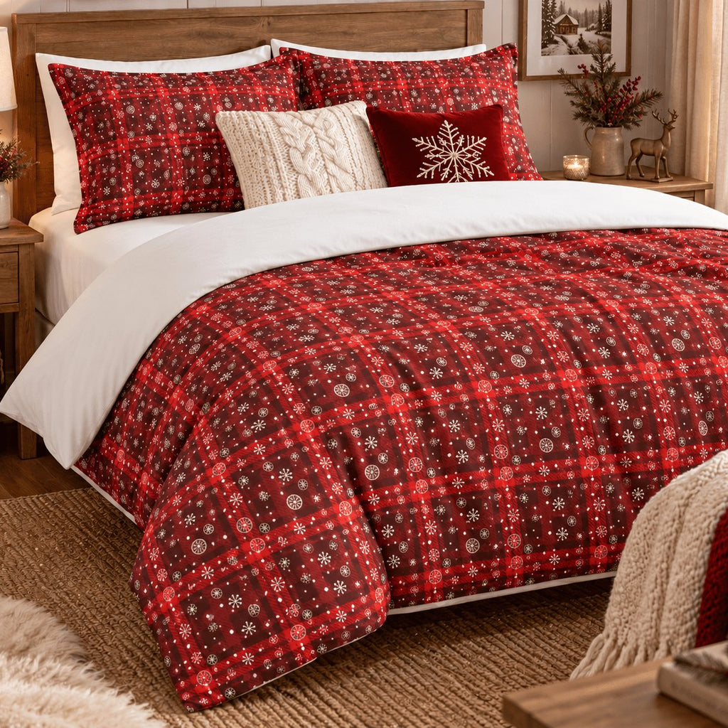 Tartan Snowflake Christmas duvet cover set, right angled view showing tartan duvet with cream knit throw at the foot