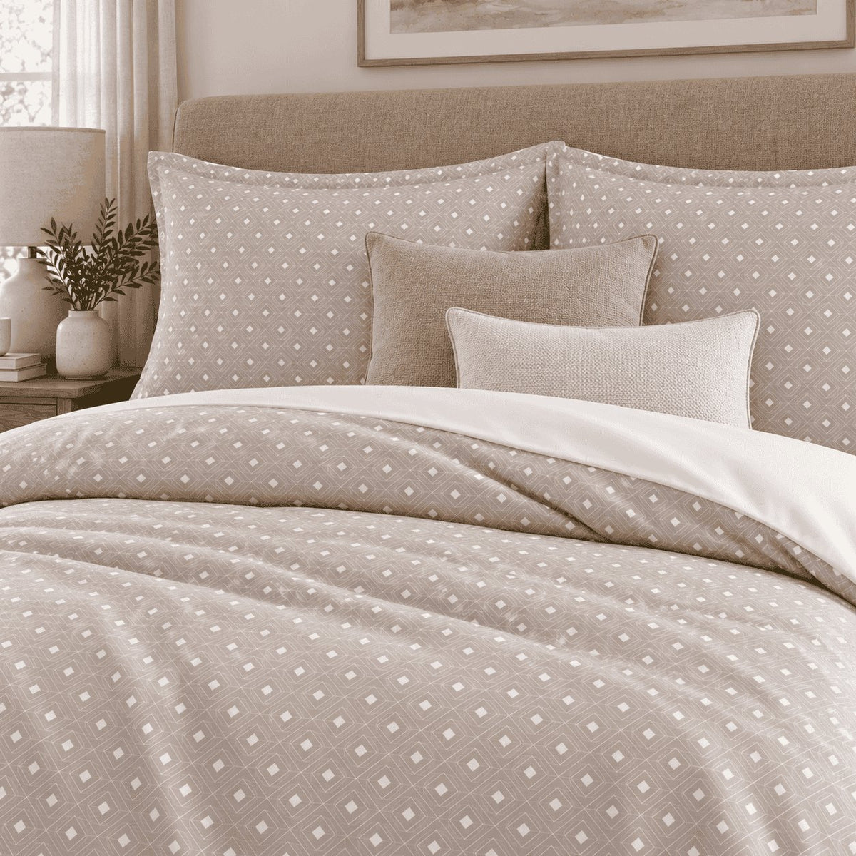Taupe Diamond Trellis duvet cover set, close-up of pillowcases showing trellis pillowcases with sand and ivory cushions