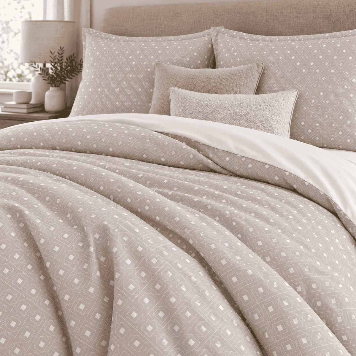 Taupe Diamond Trellis duvet cover set, close-up of print showing white squares inside a fine diamond outline on taupe folds