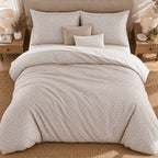 Taupe Diamond Trellis duvet cover set, overhead view showing the whole bed on a jute rug with a white sheet turned down