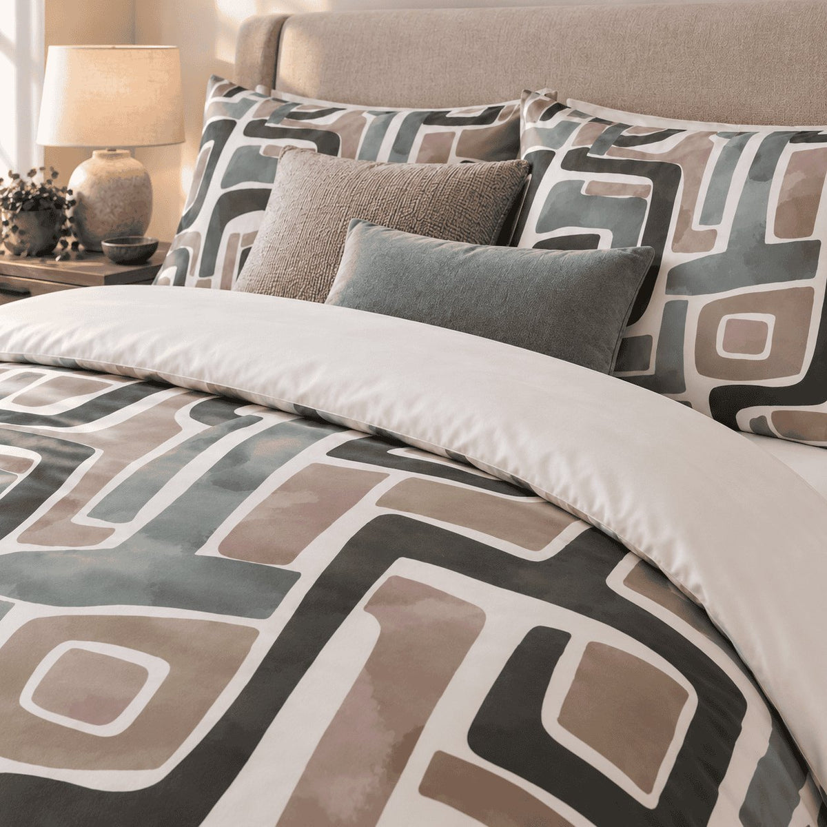 Taupe Sage Maze Abstract duvet cover set, close-up of maze pillowcases with taupe and sage velvet cushions
