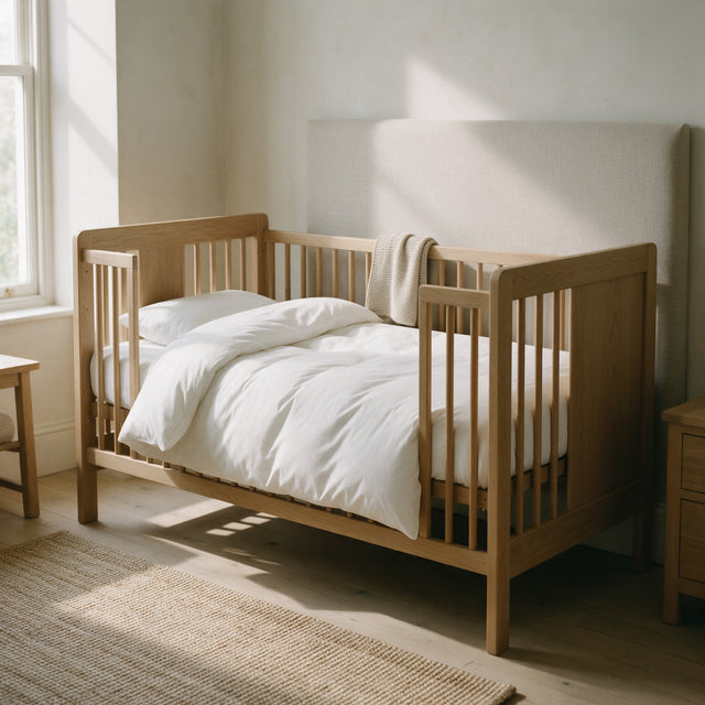 Toddler Duvet 120x150 cm made up on a pale oak cot bed in a nursery