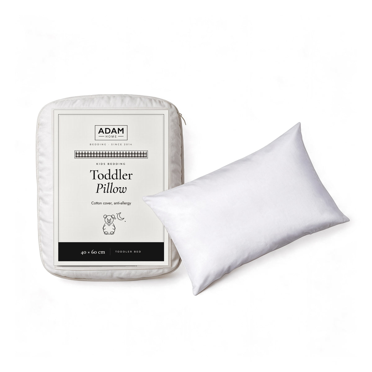 Toddler Pillow 40x60 cm in its ADAM HOME pack beside the pillow