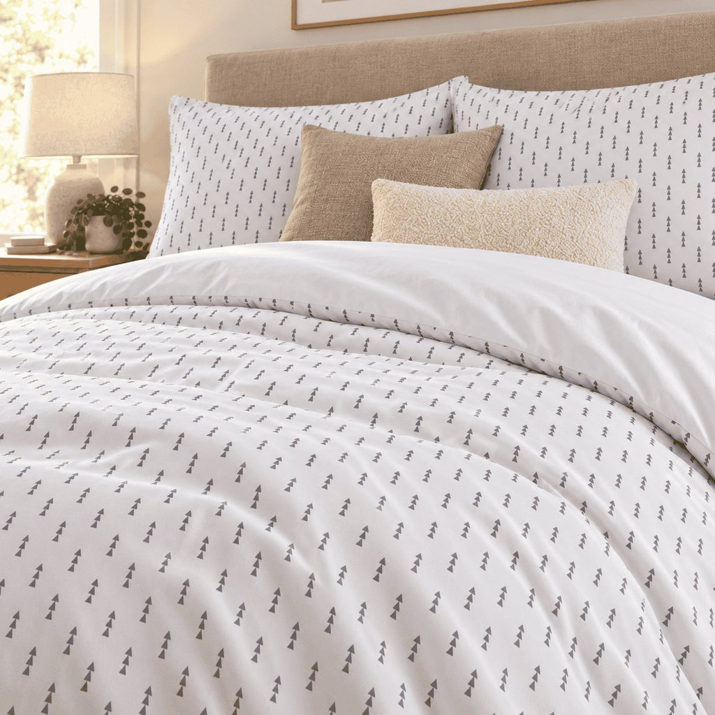 White Grey Triangle Arrow duvet cover set, close-up of pillowcases showing arrow pillowcases behind mushroom and cream cushions