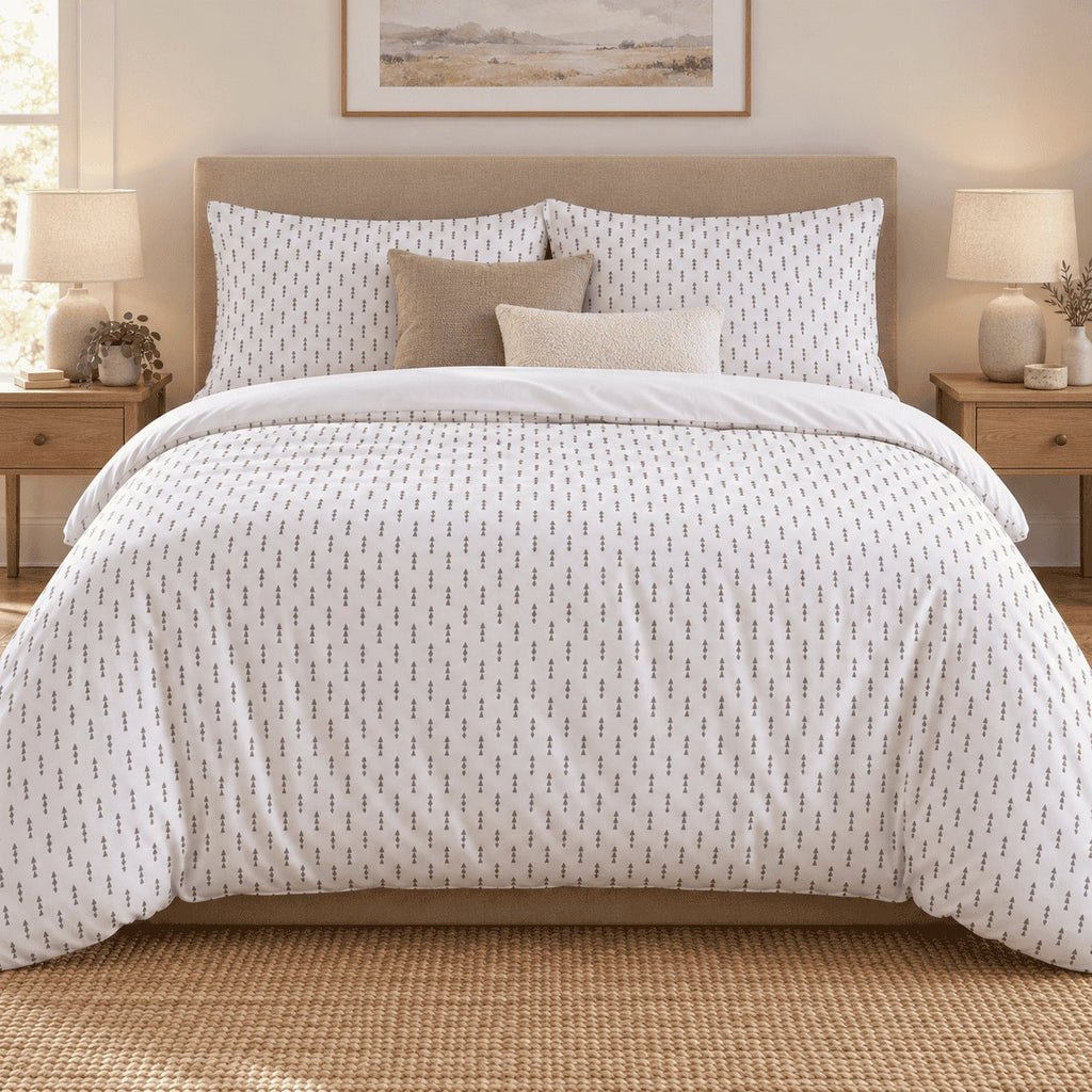 White Grey Triangle Arrow duvet cover set, front view showing grey triangle arrows on white with mushroom and cream cushions